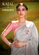 KIMORA Organza Saree Is A Masterful Blend Of Delicate Embroidery And Intricate Sequence Cutwork Along Its Border