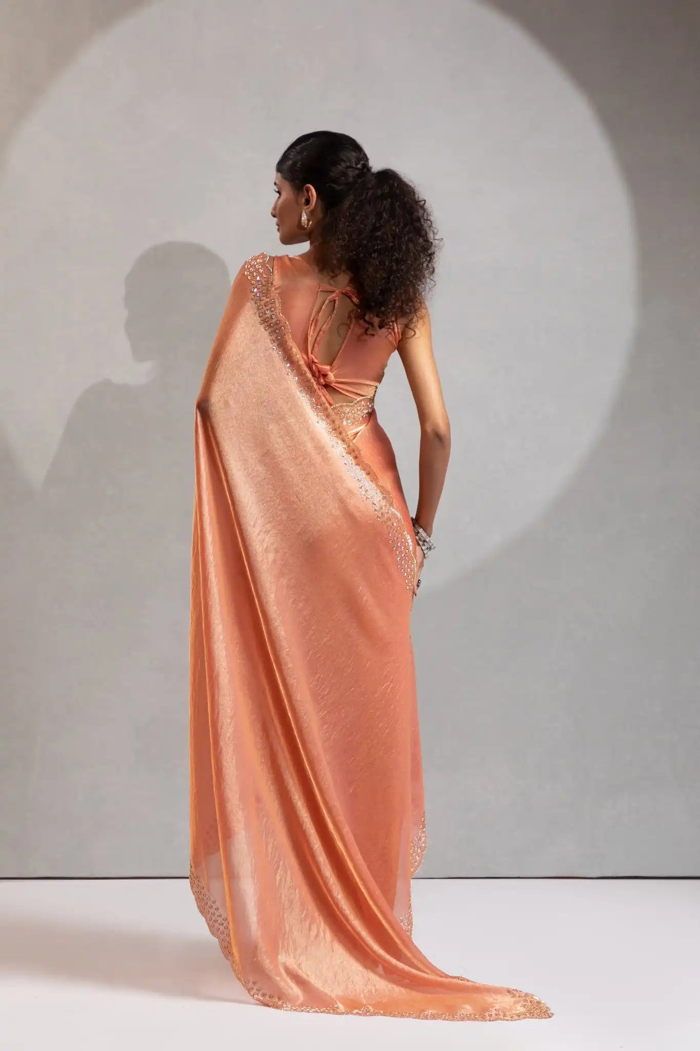 The Mehek Saree Showcases Exquisite Satin Silk Fabric Adorned With Elegant Foil