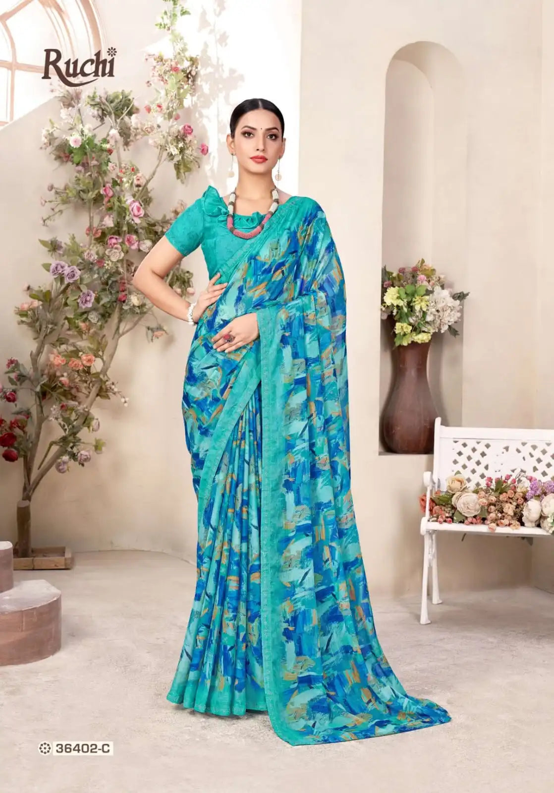 Ruchi Chiffon Saree Featuring A Delicate Swarovski Crystal Border That Adds A Subtle Sparkle