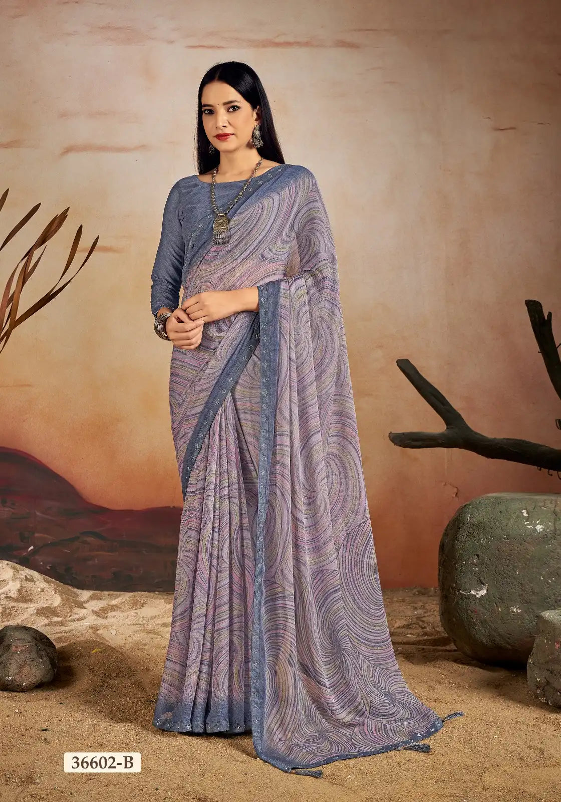 Ruchi Chiffon Saree Features A Delicate Chiffon Fabric Enhanced With A Border Embellished With Crystal