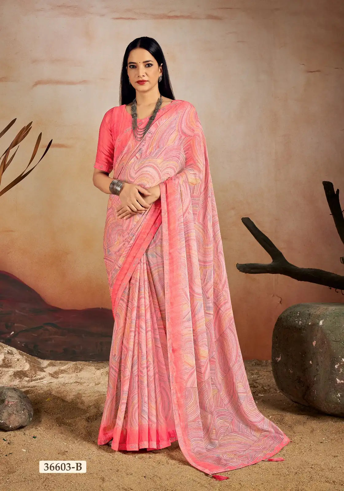 Ruchi Chiffon Saree Features A Delicate Chiffon Fabric Enhanced With A Border Embellished With Crystal