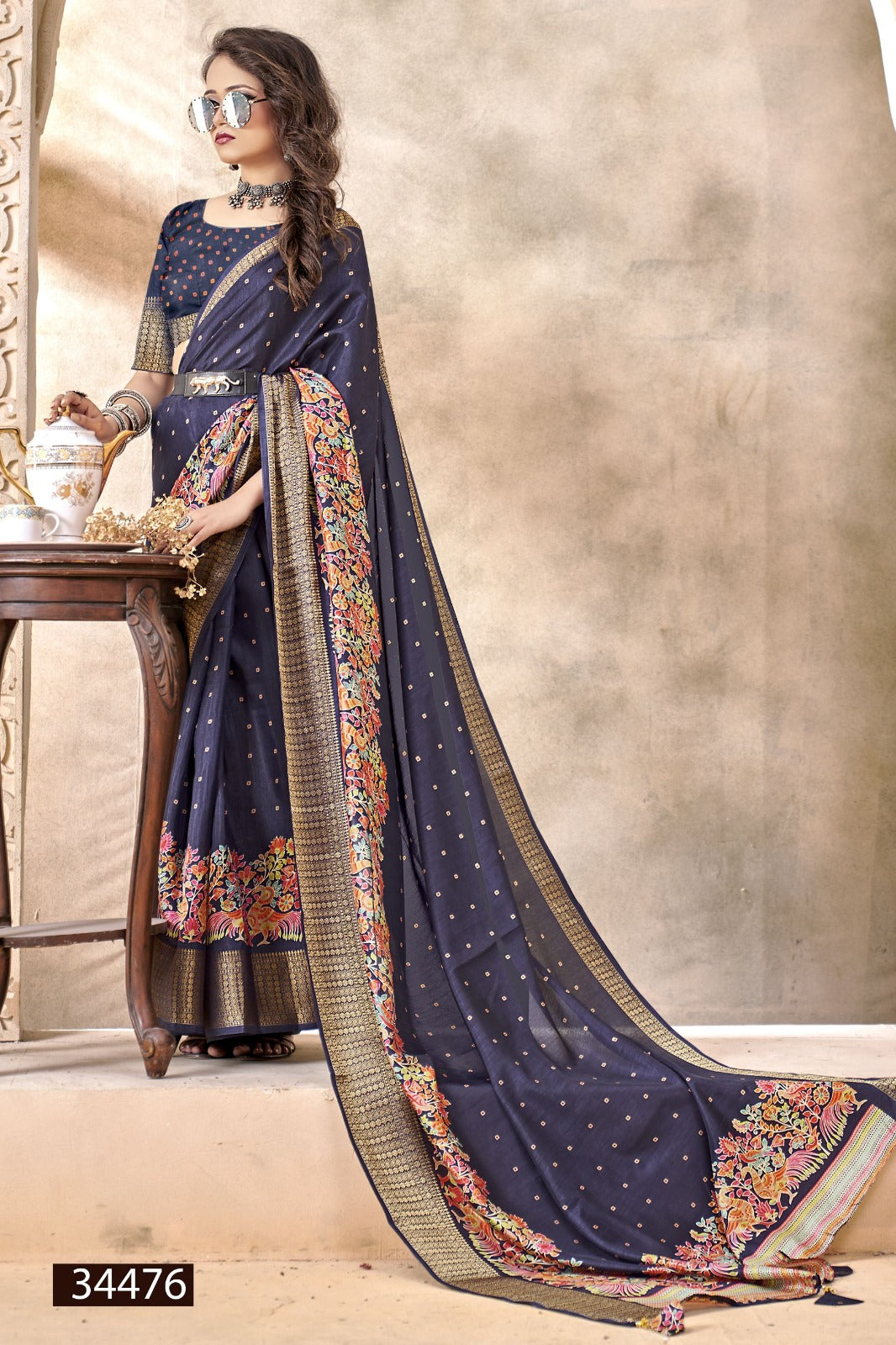 The Vallabhi Print Collection features sarees made from premium Dola Silk fabric, adorned with exquisite ethnic prints