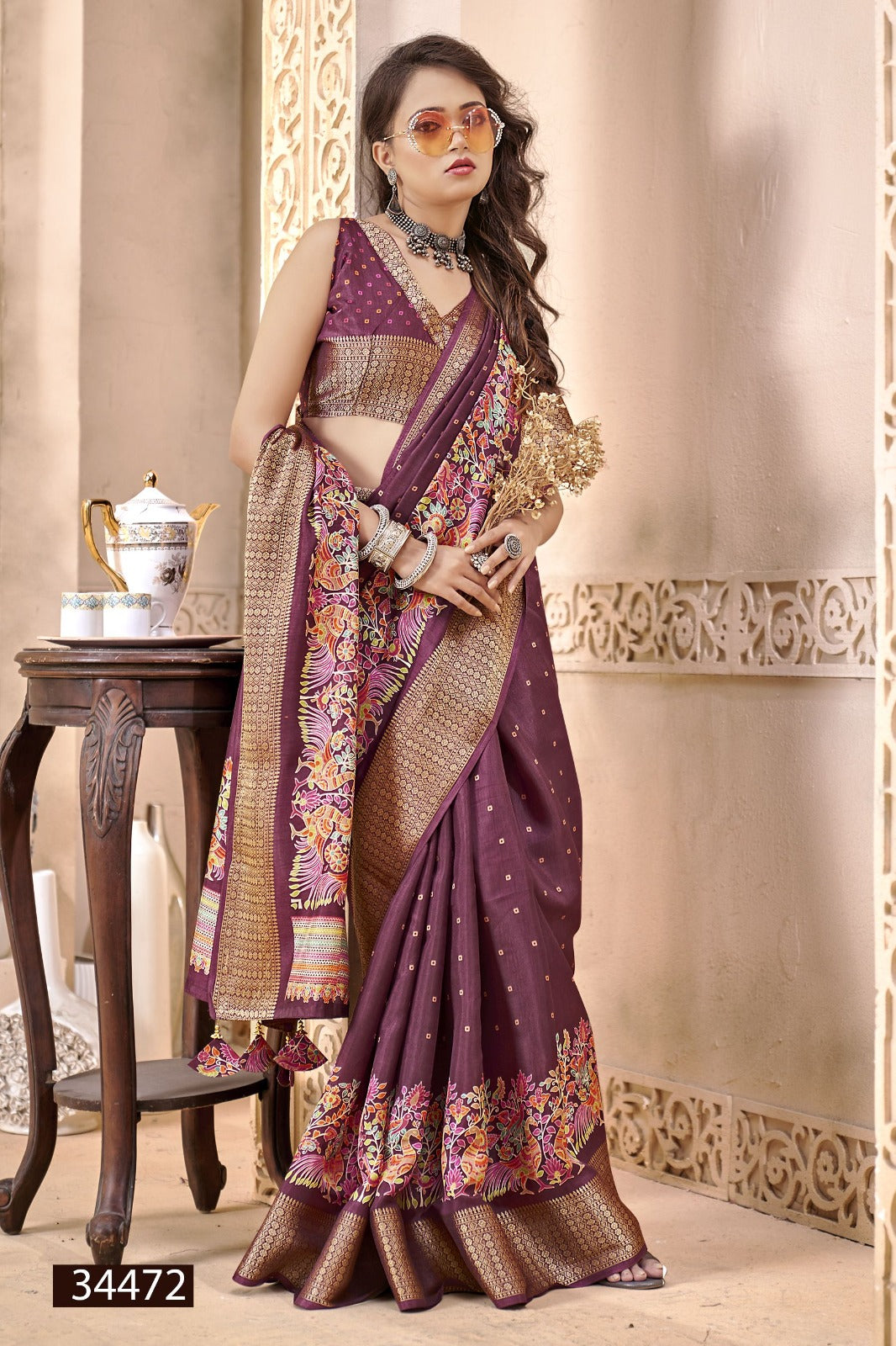 The Vallabhi Print Collection features sarees made from premium Dola Silk fabric, adorned with exquisite ethnic prints