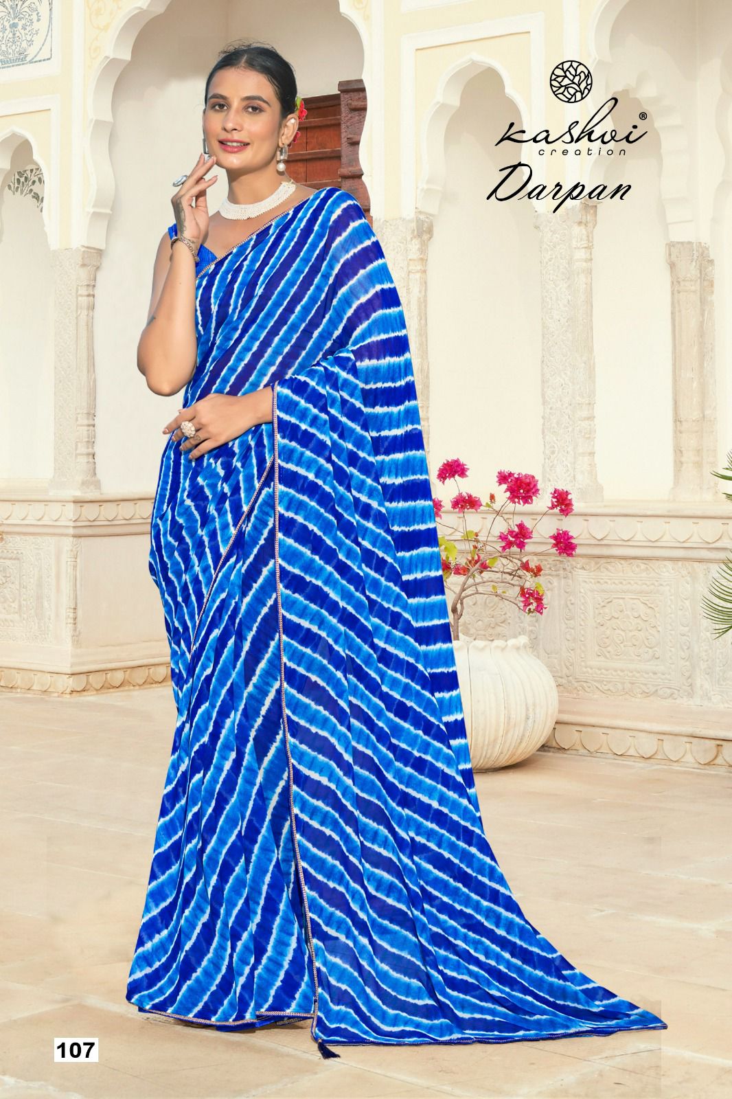 The Kashvi Creation Saree showcases a beautiful georgette fabric with traditional Lehariya patterns