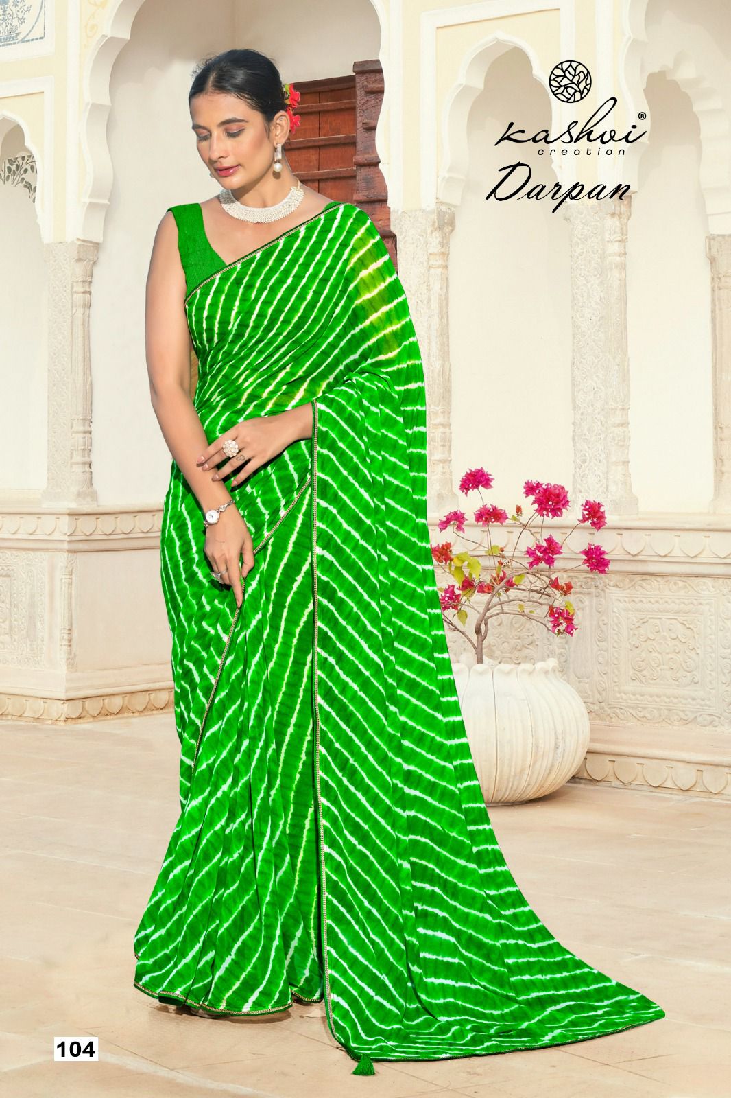 The Kashvi Creation Saree showcases a beautiful georgette fabric with traditional Lehariya patterns