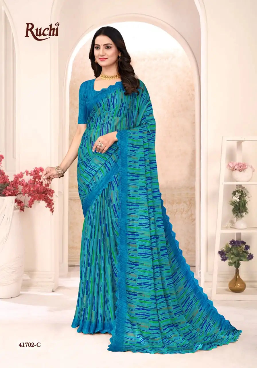 Ruchi Sarees Presents A Chiffon Saree Elegantly Finished With A Detailed Border Offering Comfort