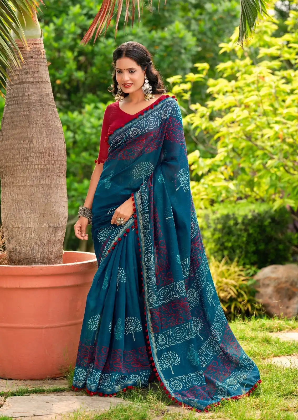 S.R. Sarees Crafted From Mul Mul Cotton Fabric Offer Exceptional Softeness And Breathability Making Them Ideal For Comfortable Wear